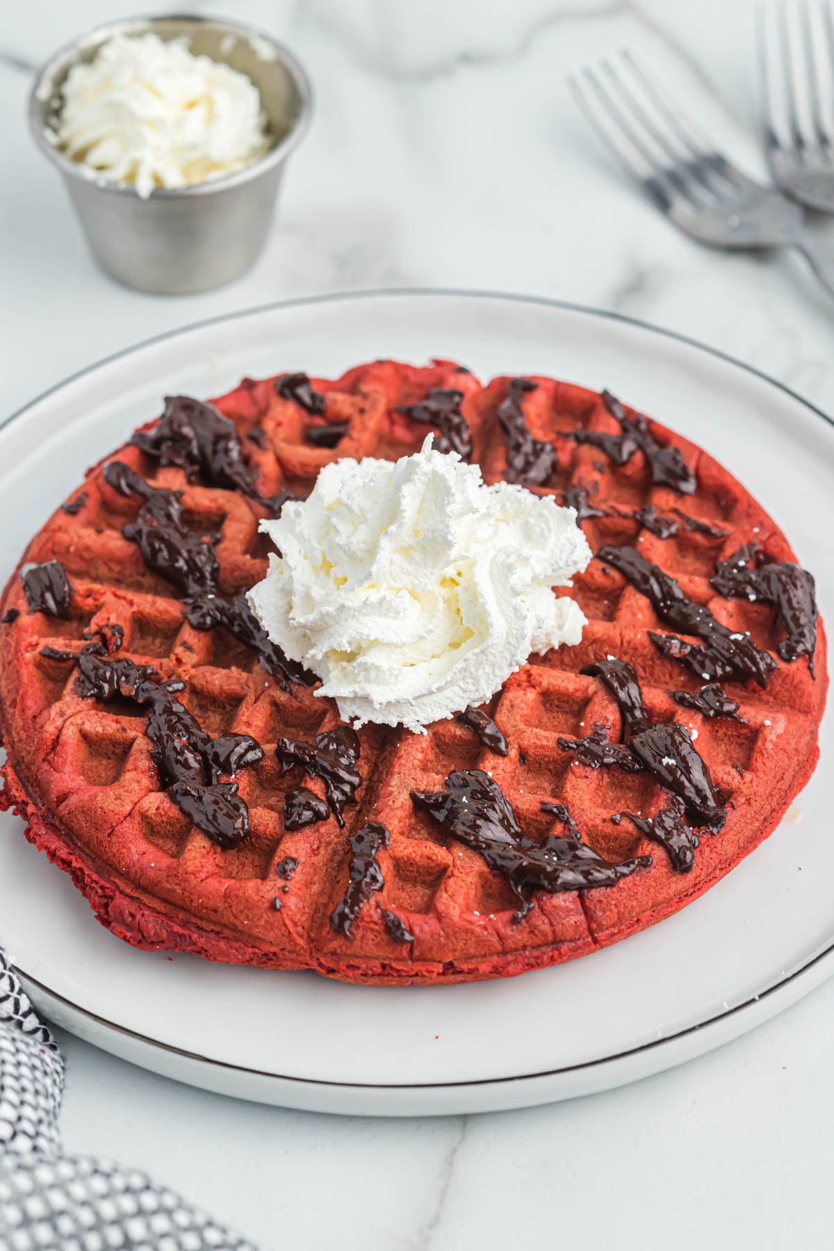 Belgium cake mix waffle on white plate.