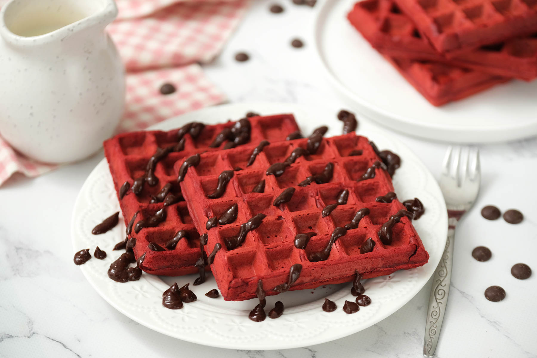 square cake mix waffle on plate with chocolate drizzle