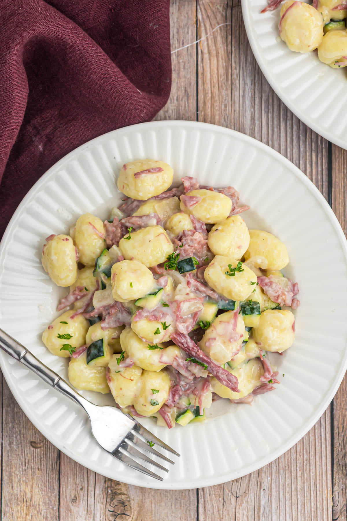 Gnocchi with Corned Beef on white plate