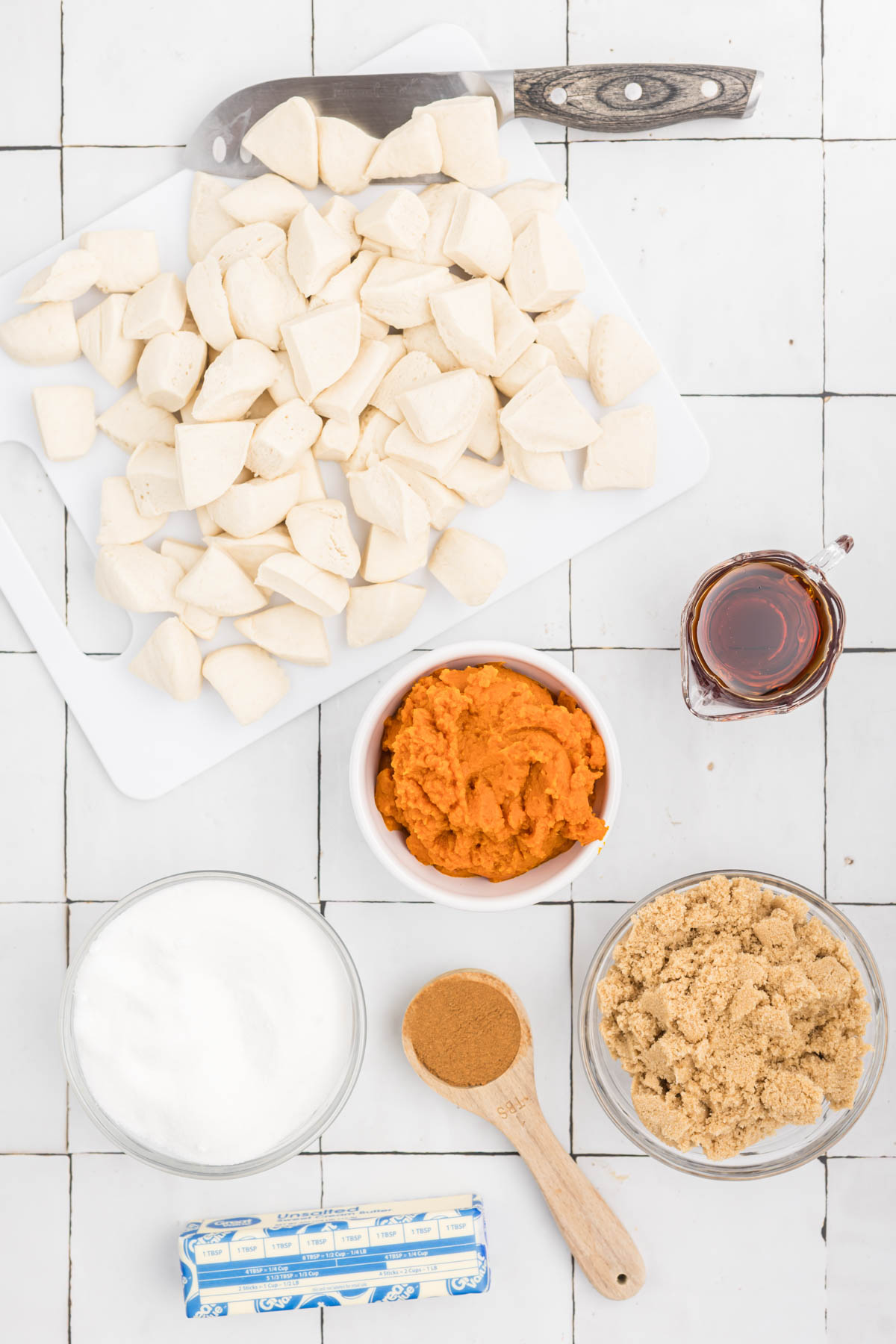 ingredients for maple pumpkin monkey bread in white bowls.